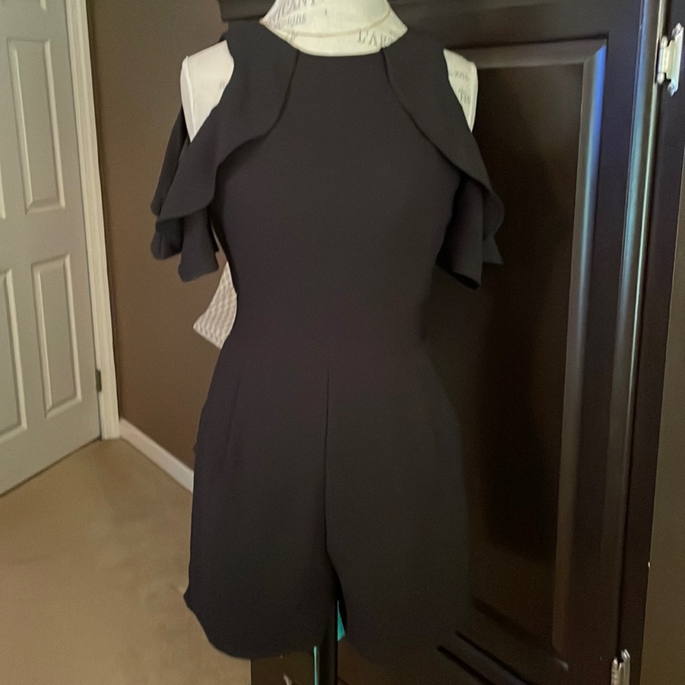 Black sleeveless ruffle romper